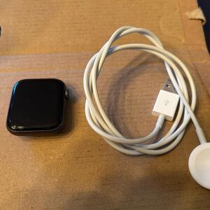 Black Smartwatch with White Charger